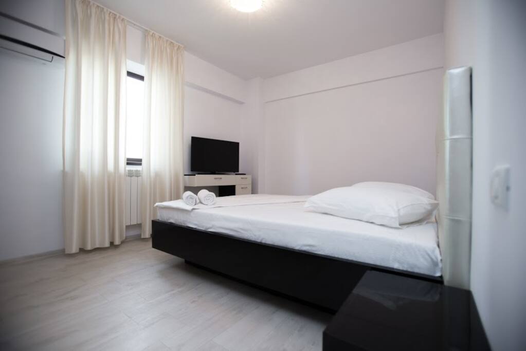 The bedroom is equipped with double bed and clothes storage space.