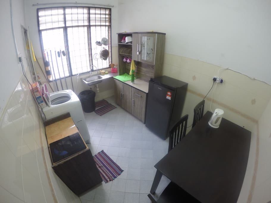 Kitchen equipped with cooking ware, refrigerator & washing mashine.