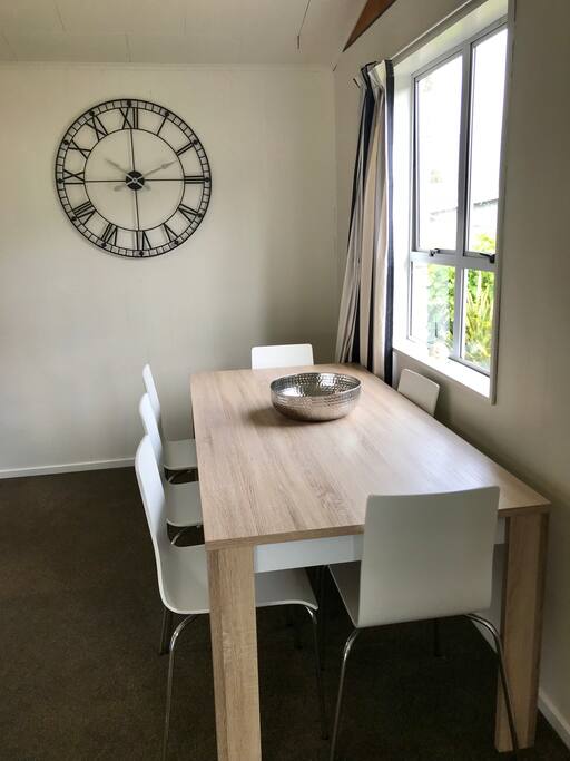 6 seater dining room and 2 bar stools at the kitchen bench