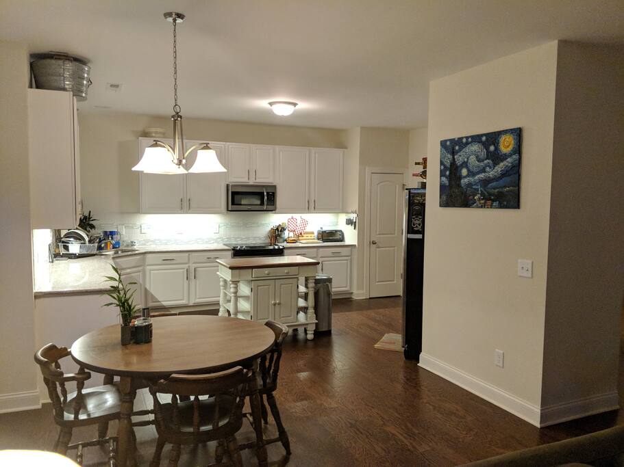 Extra large, spacious kitchen opens up to breakfast area and living room