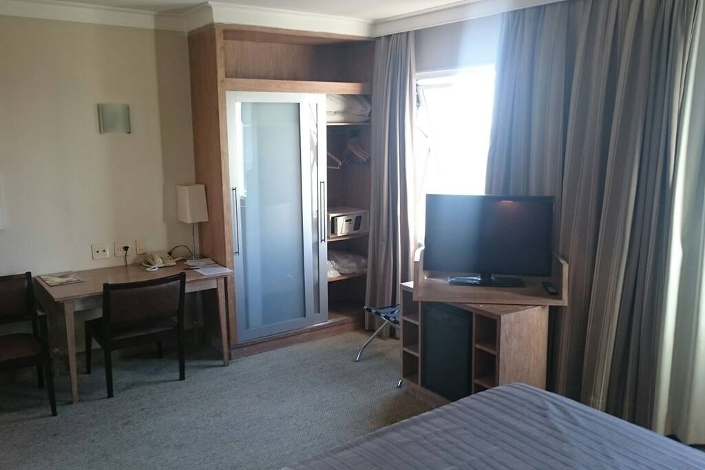 Desk, wardrobe, safe, flat TV