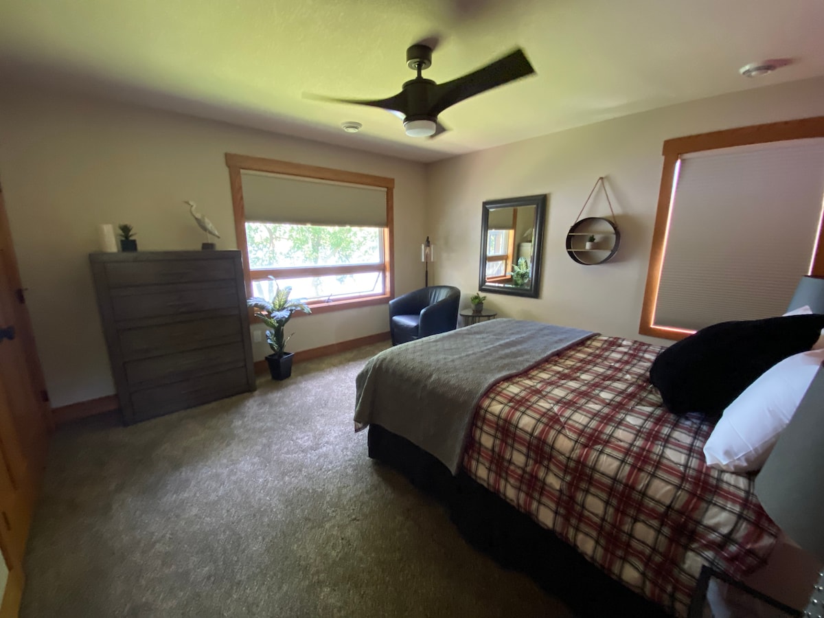Queen Bed with river view upstairs. 