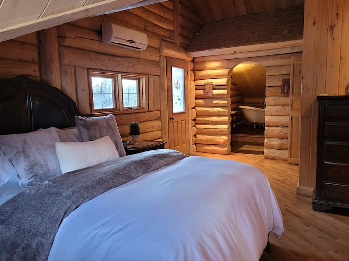 Master suite #2 with private balcony and en-suite bathroom with clawfoot bath.