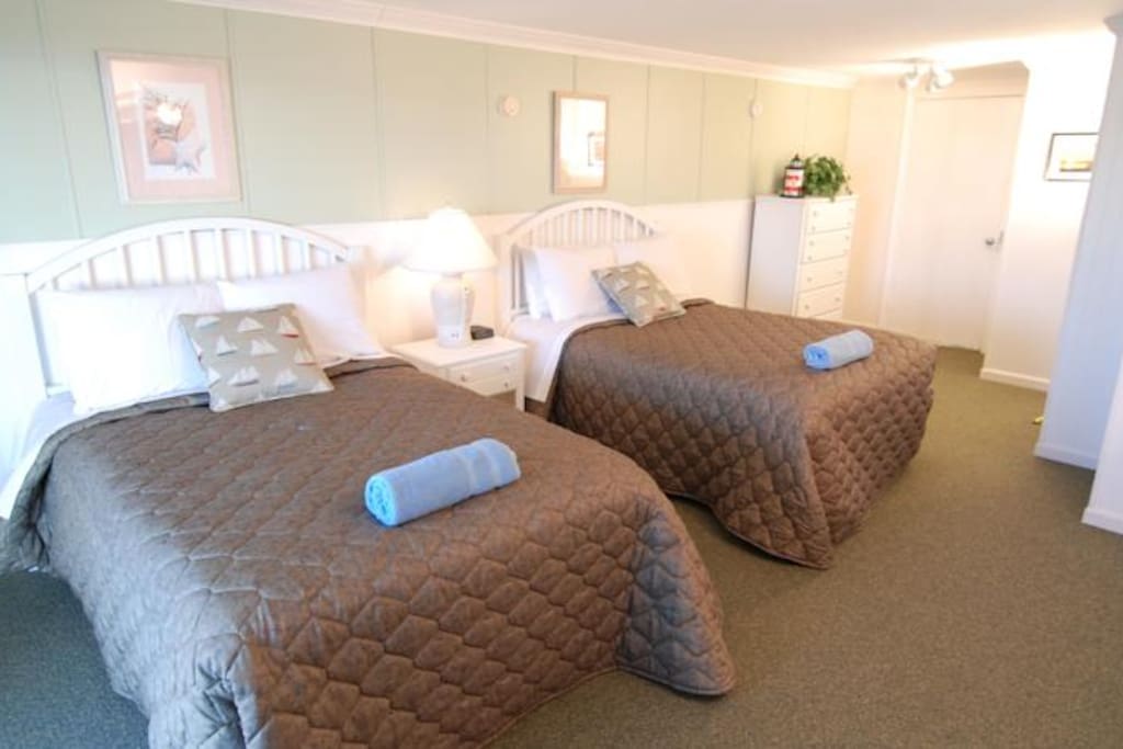 Two double beds in private, large, bedroom.