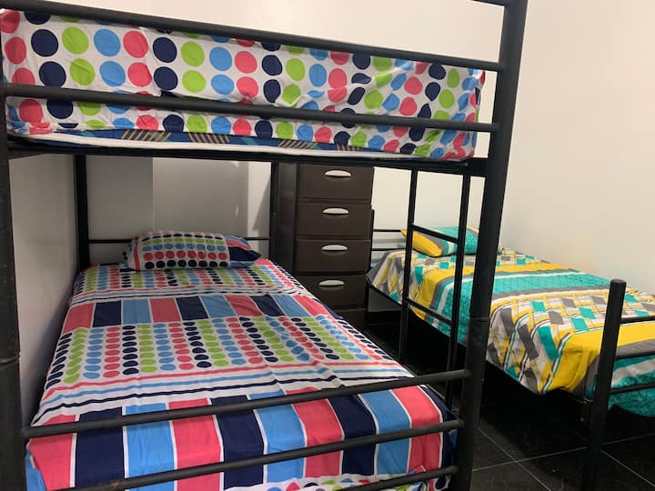Bedroom 1 with 3 beds and full bathroom