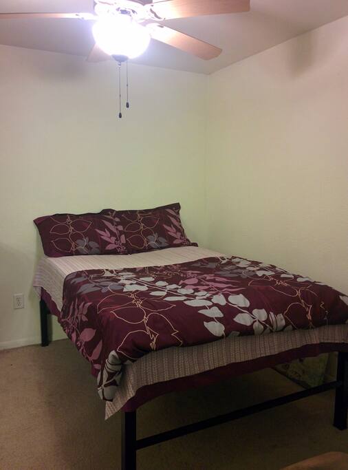 A comfy full size bed, as perfect for a couple as for a single person