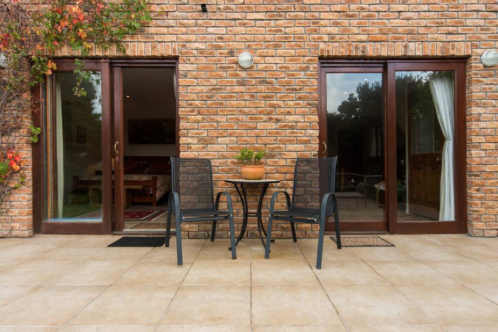 Private cottage with patios in a peaceful garden setting