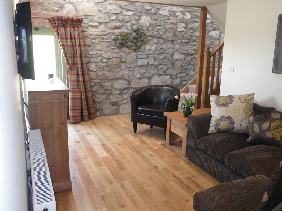 The cosy living room is totally private and has a door to your own garden.