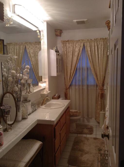 Fully appointed large bathroom with shower and tub including lots of vanity space and storage. This room is located right next door to the bedroom and is dedicated solely for guests - both bathroom and bedroom are located right off kitchen, dining and living rooms - all conveniently located on one floor and is perfect in the event you would like to host a dinner or entertain family and/or friends. There is also a tv in living room if your group would like to watch a movie or tv together.