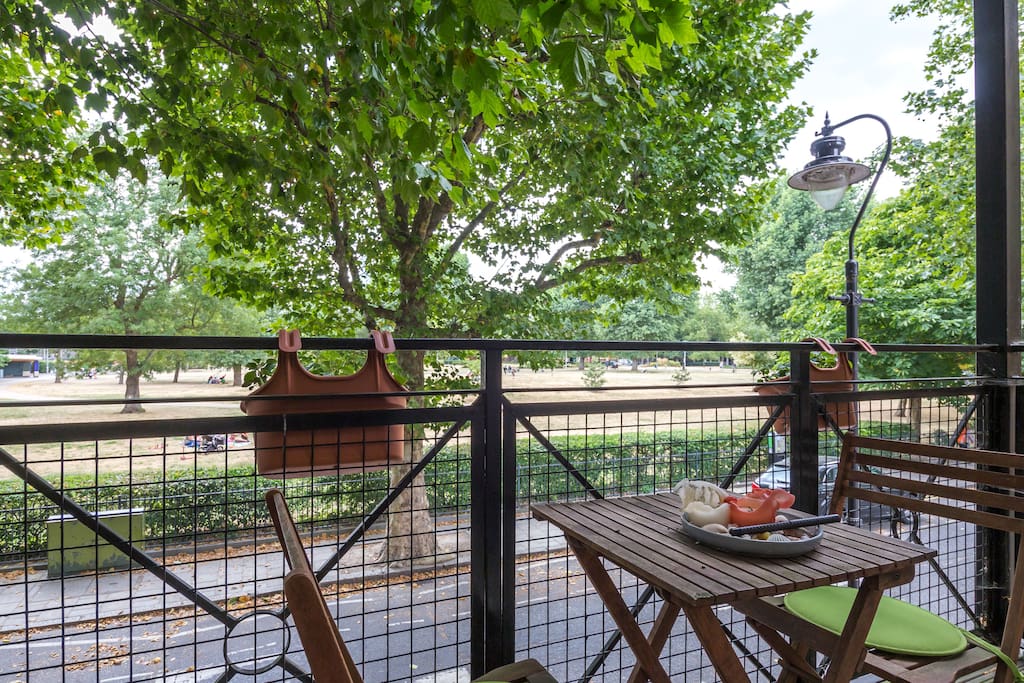 A private balcony overlooking a park...