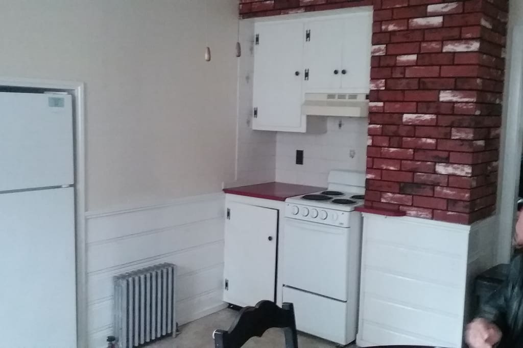Kitchen area,
with micro, coffee maker,stove, fridge, kit table and chairs