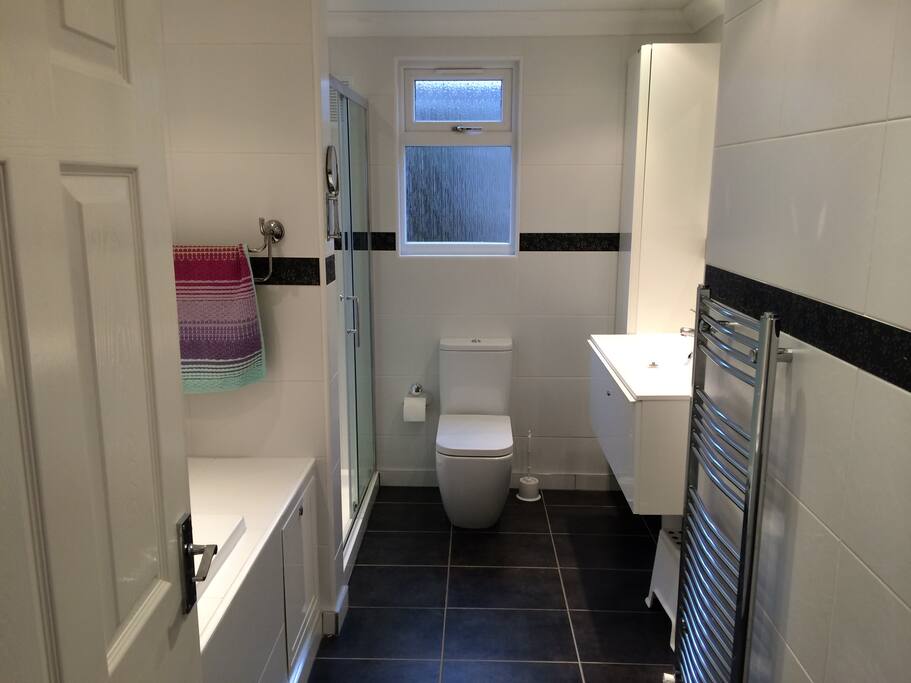 Bathroom with bath and shower