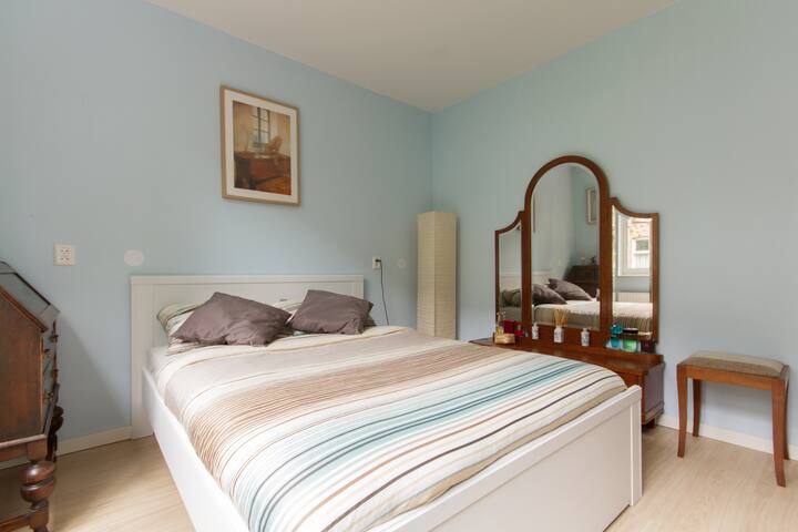 The peaceful and classic master bedroom, with a comfortable bed so you will have a  good night rest at the quiet backside