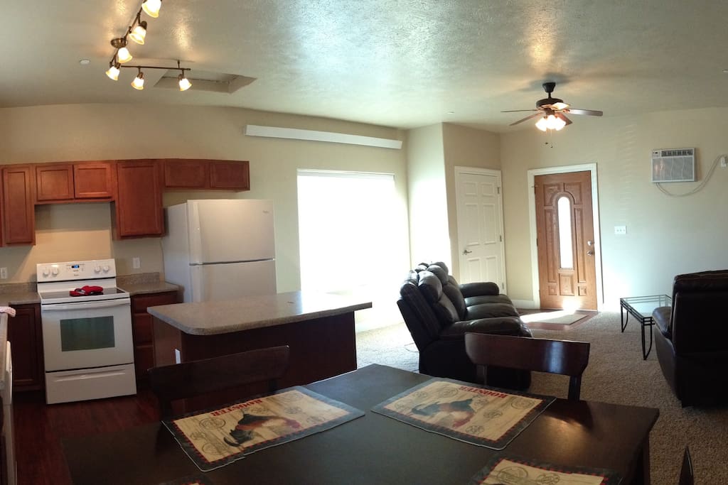 Panorama view of the living, dining and kitchen from the patio door.