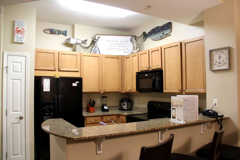 Nicely decorated kitchen with granite counter tops