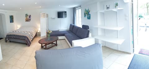 Large studio with garden by the river.