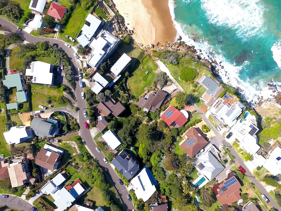 Areal shot from a drone right on top of our house (grey roof)