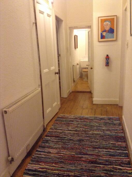 Entrance hall and bathroom with shower and bath