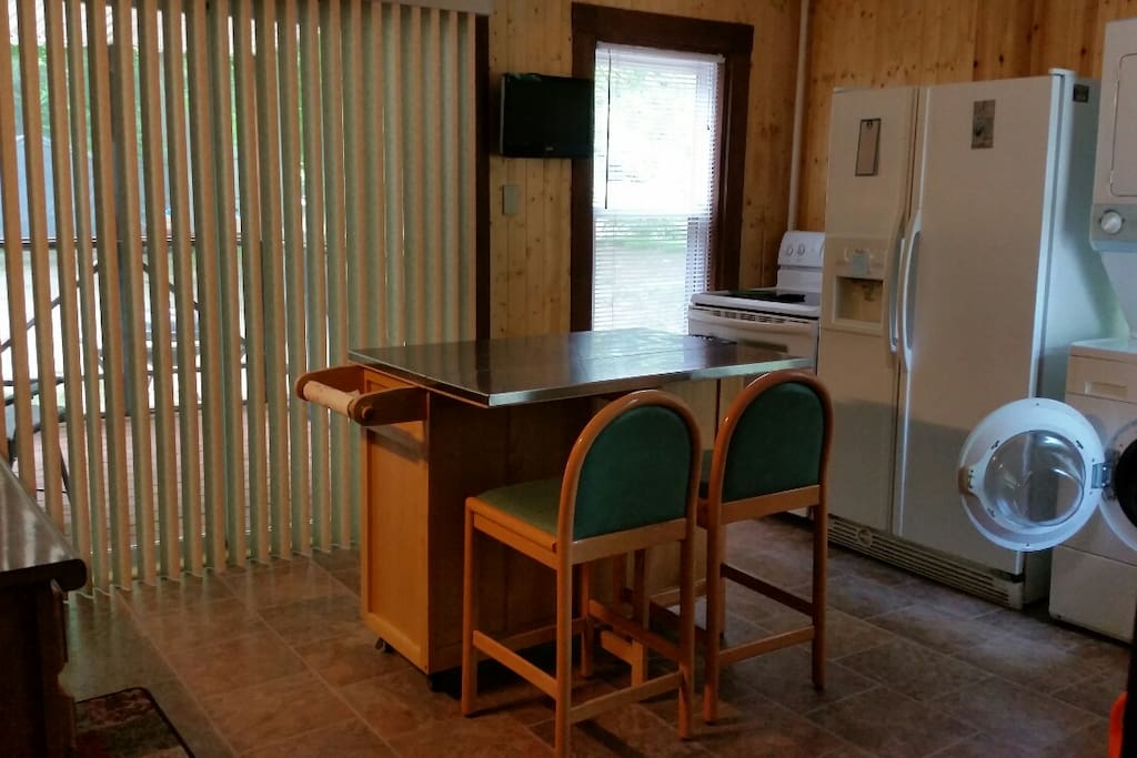 Kitchen area with washer/dryer, Keurig coffee maker, microwave, only missing your groceries!