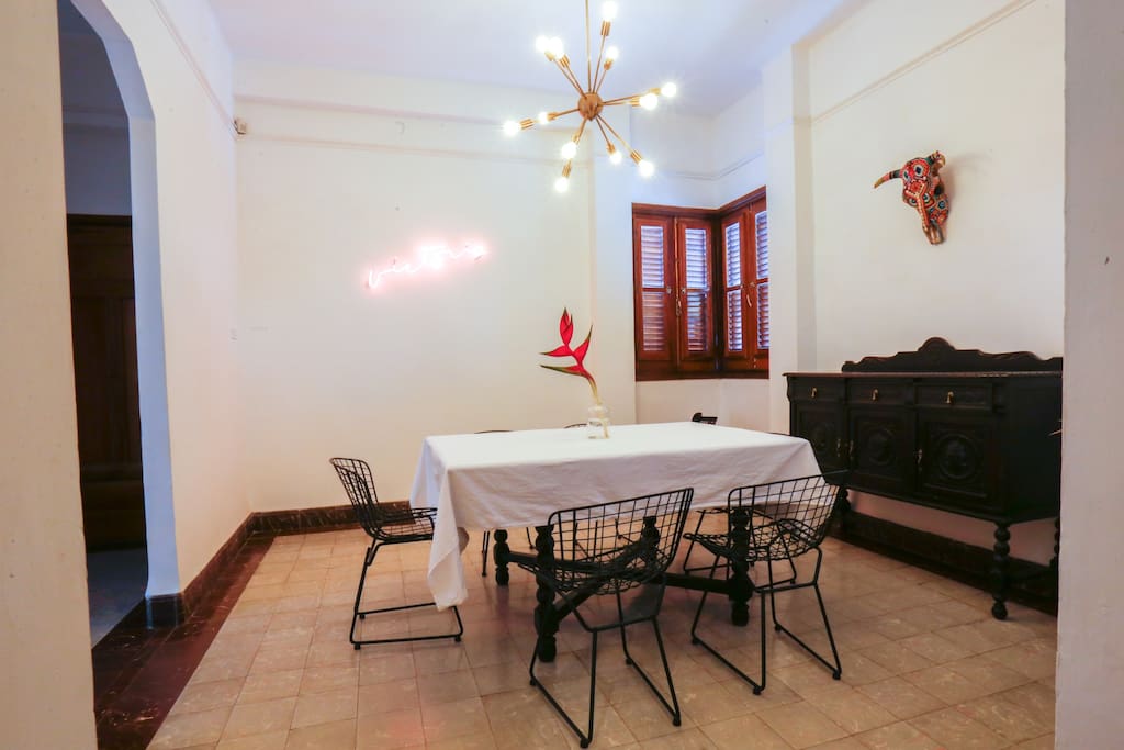 Dining area with dimmable Edison lightbulbs and artwork by local artists