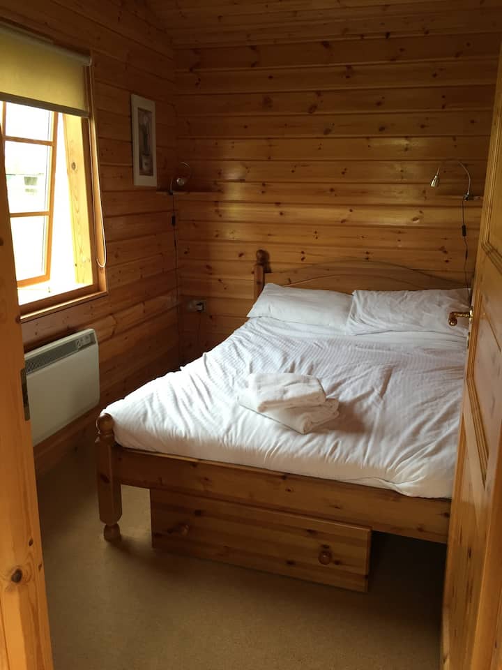 Double bedroom with sheets, towels and under bed storage 