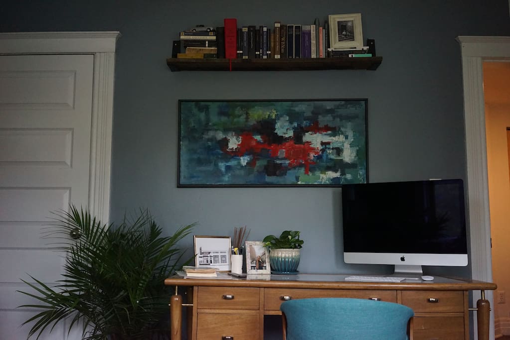 Living room with desk and more books!