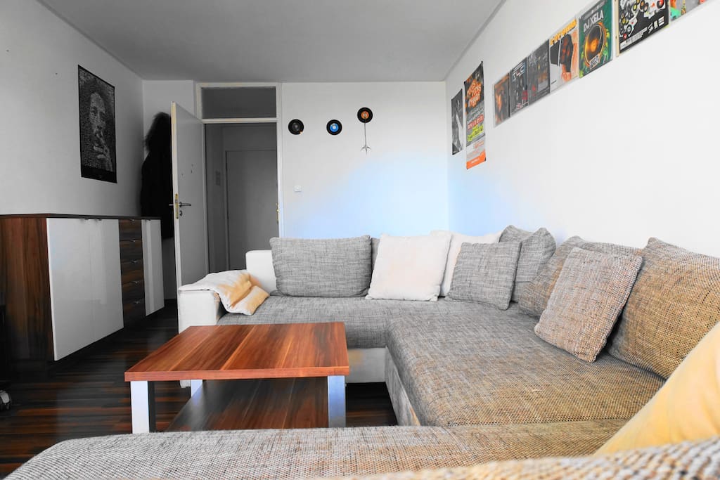 Comfy couch in the bright living room is perfect for a quiet moment after a busy day in Munich.