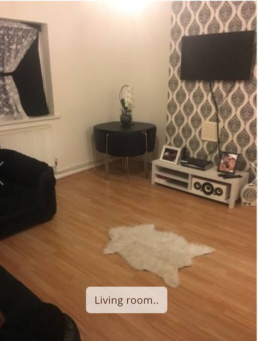Cosy living room with a flat screen tv and comfy L shape sofa, with four good sized seats. Also a dining table to eat all meals aswell as work surface...