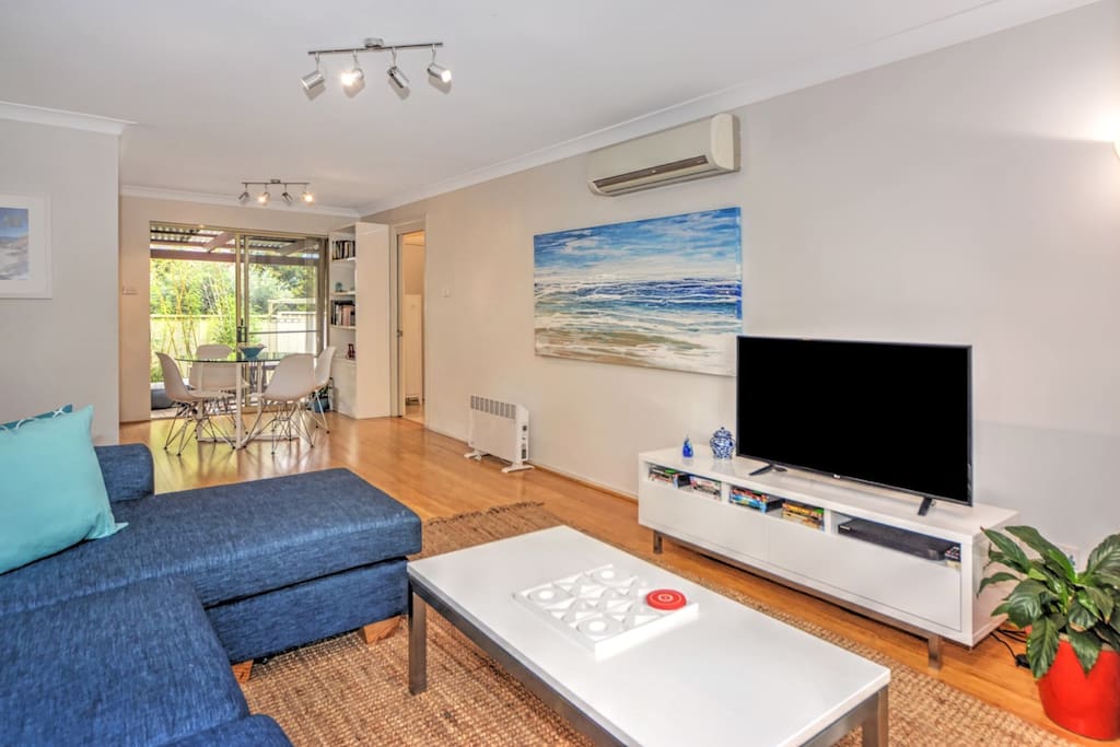Living Room Bamboo floors
Large TV
Videos-Books