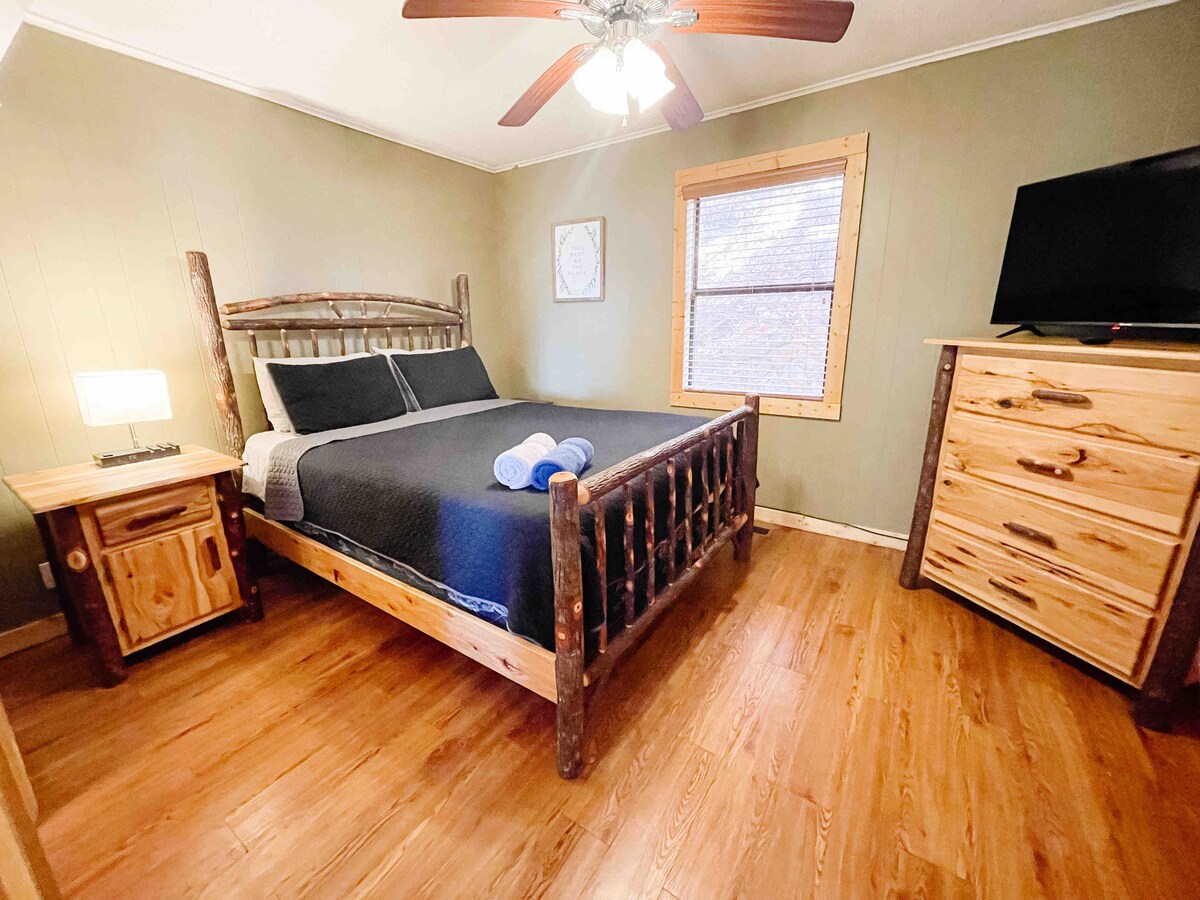 The main floor bedroom has a Roku TV, a dresser, and a closet with board games and puzzles! You also have a private door to access the full bath, in case you're not ready to face the world first thing in the morning before you've had your shower!