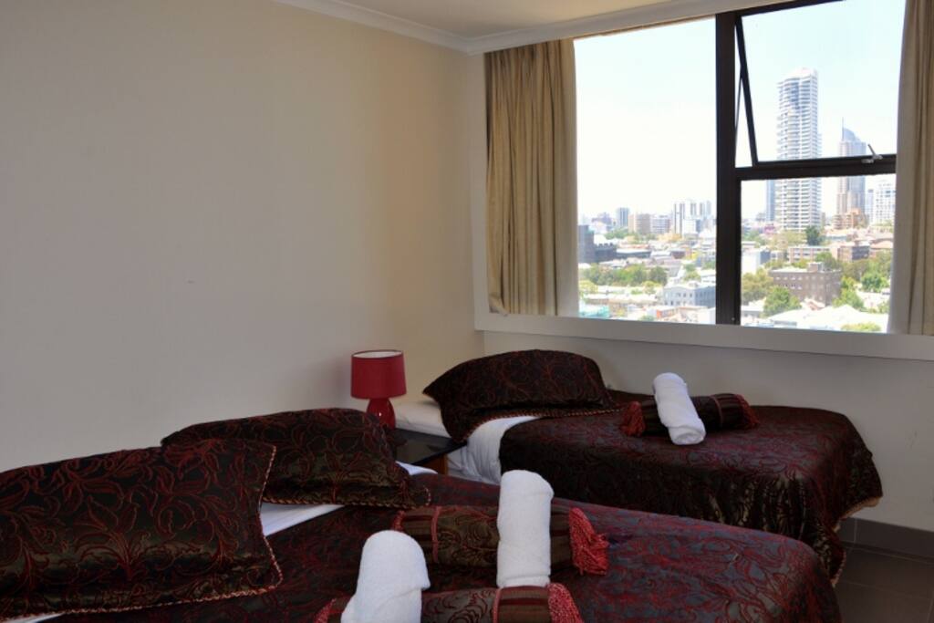 Bedroom 2 with queen and single beds