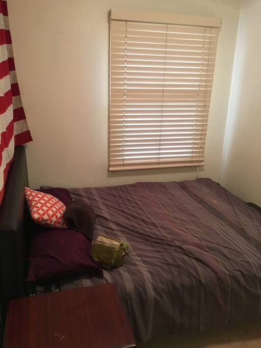 Bedroom has a double bed and built in wardrobe. Toilet and shower facilities are shared.