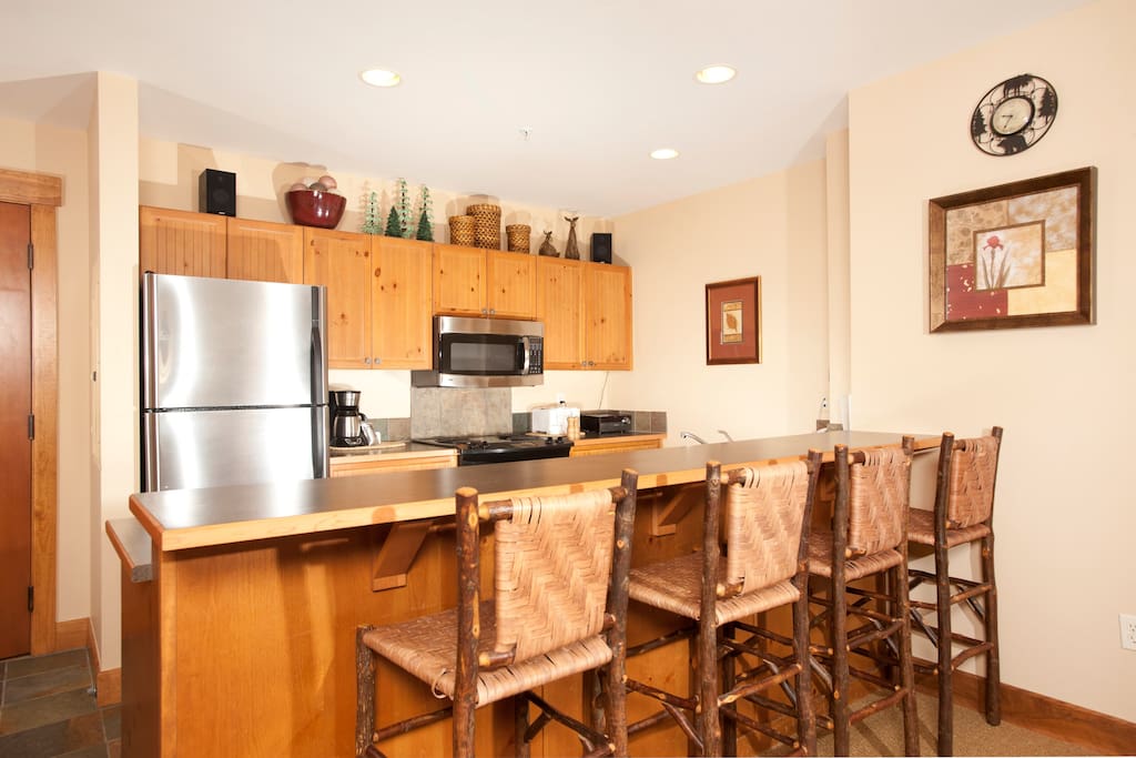 Enjoy cooking in the fully-equipped kitchen, complete with stainless steel appliances and convenient breakfast bar
