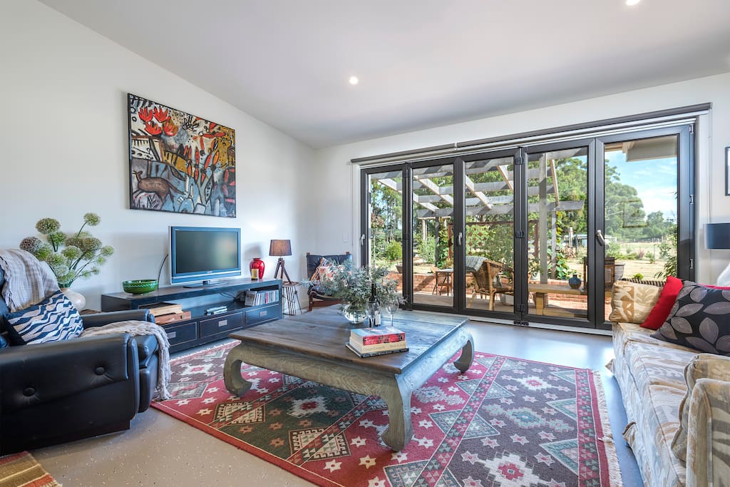 Cosy living room with views of the garden and terrace