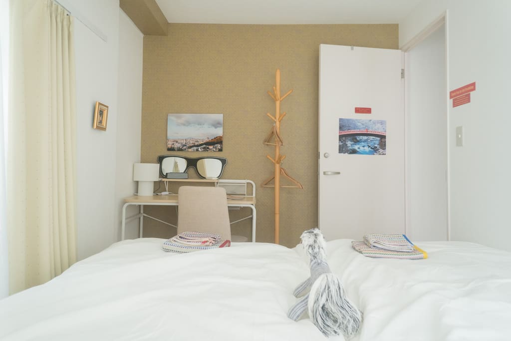two single beds, desk, in bedroom 1