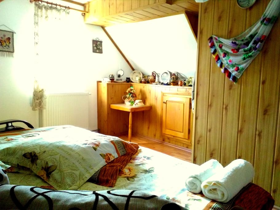 Comfy and snug room with double bed, enriched with traditional ornaments and rugs.