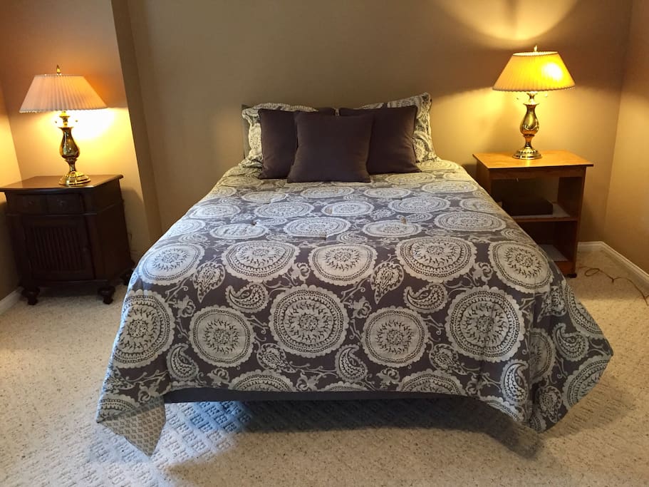 Comfy queen size bed is located in a separate bedroom.