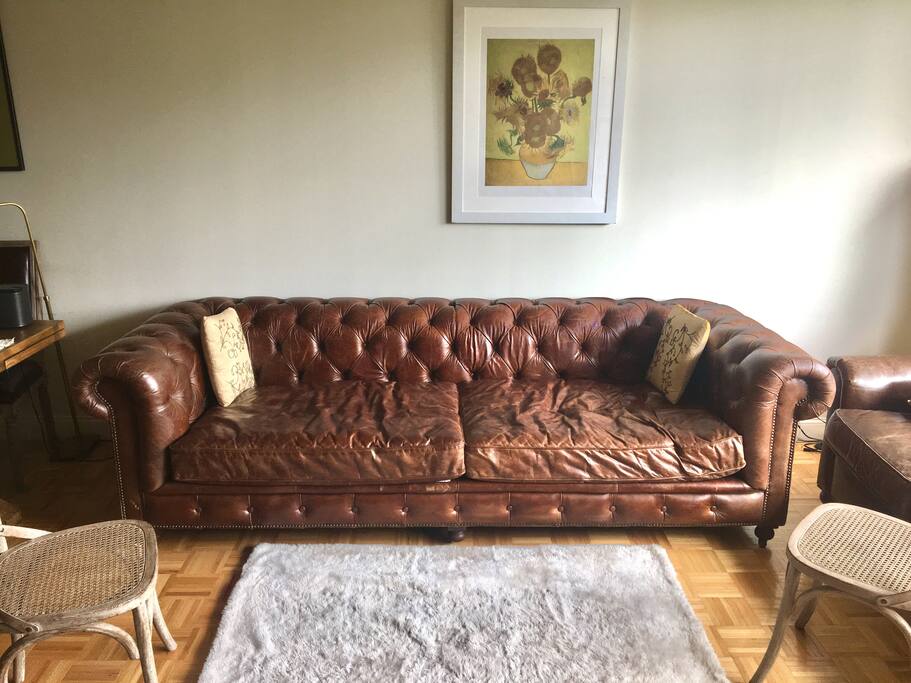 A classic restoration hardware 6 ft by 2.5" deep deep brown leather couch