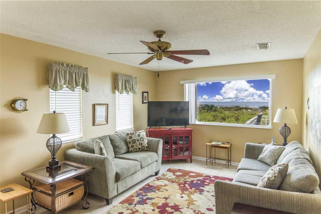 Second floor living room - The second floor is the main living space, with comfy recliners and couches, windows everywhere, and d