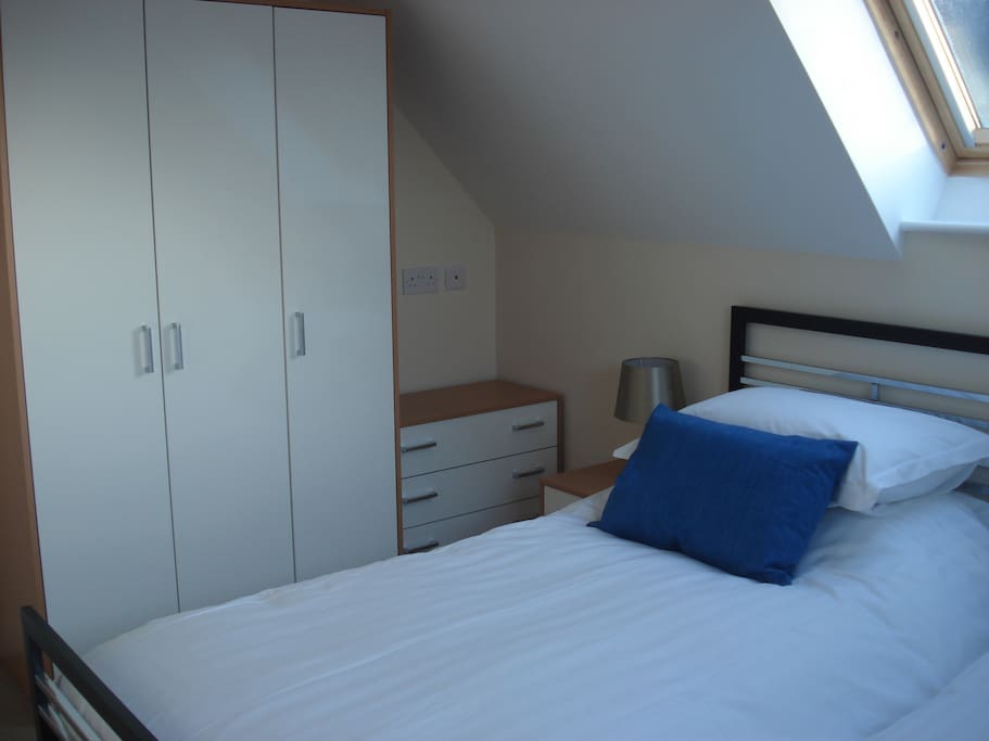 A side view of the twin bedroom, all bed linen and towels provided