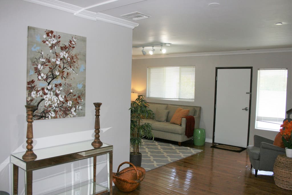 Entry way and foyer with view into living room
