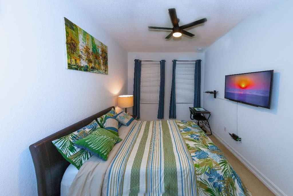 Full bed, work desk and chair, cable TV, central air, ceiling fan.