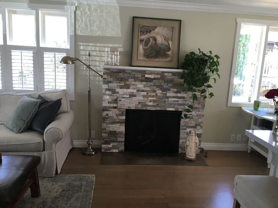 Fire place in open floor living and kitchen area