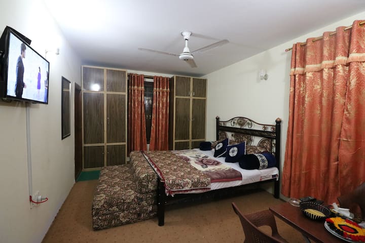 Room-1 Tidy Kamra, One King size bed with Sofa bed and attached bath