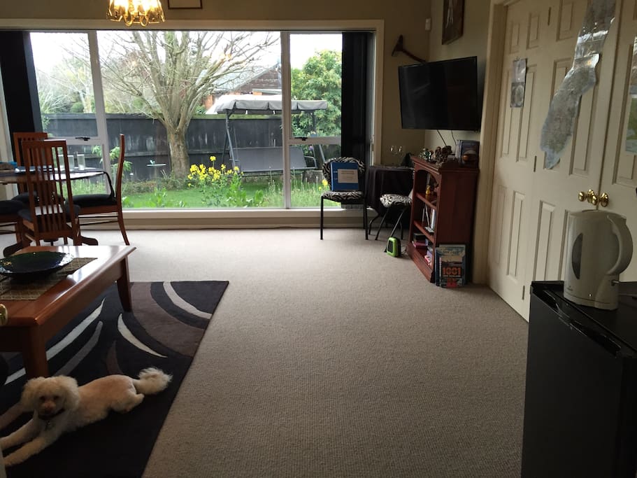 YOUR OWN large private lounge with a 6 seater lounge sofa set, fridge, TV, dining table, additional table and chairs, coffee making facilities here and in the kitchen. Lovely view of the garden.