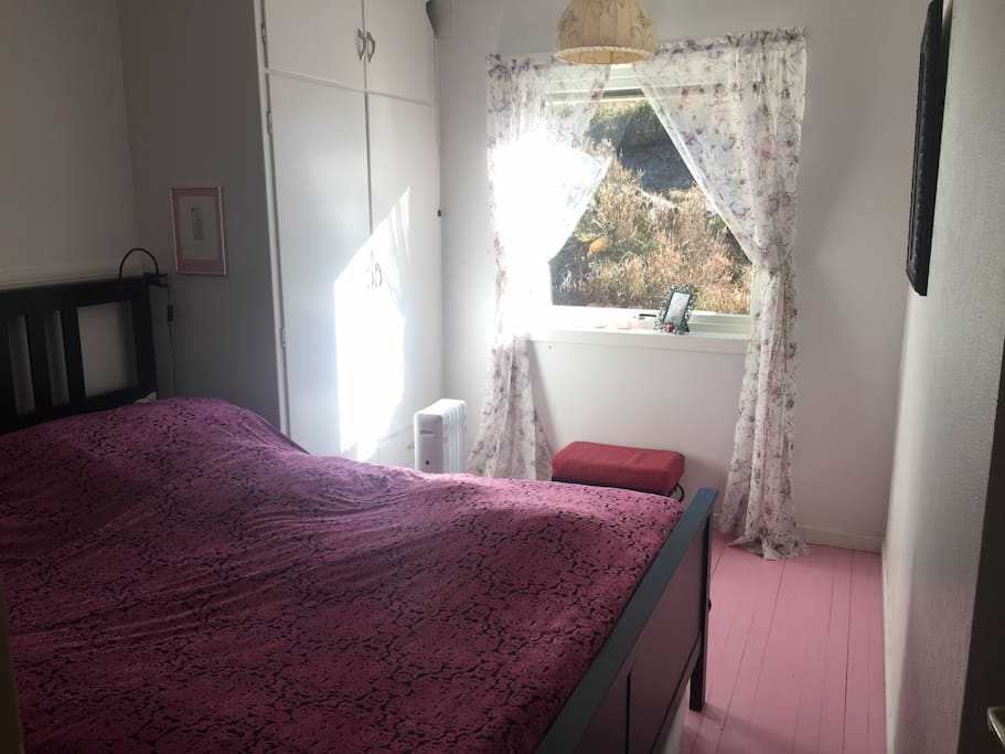 Pink room for two. Please use the cupboard if you like.