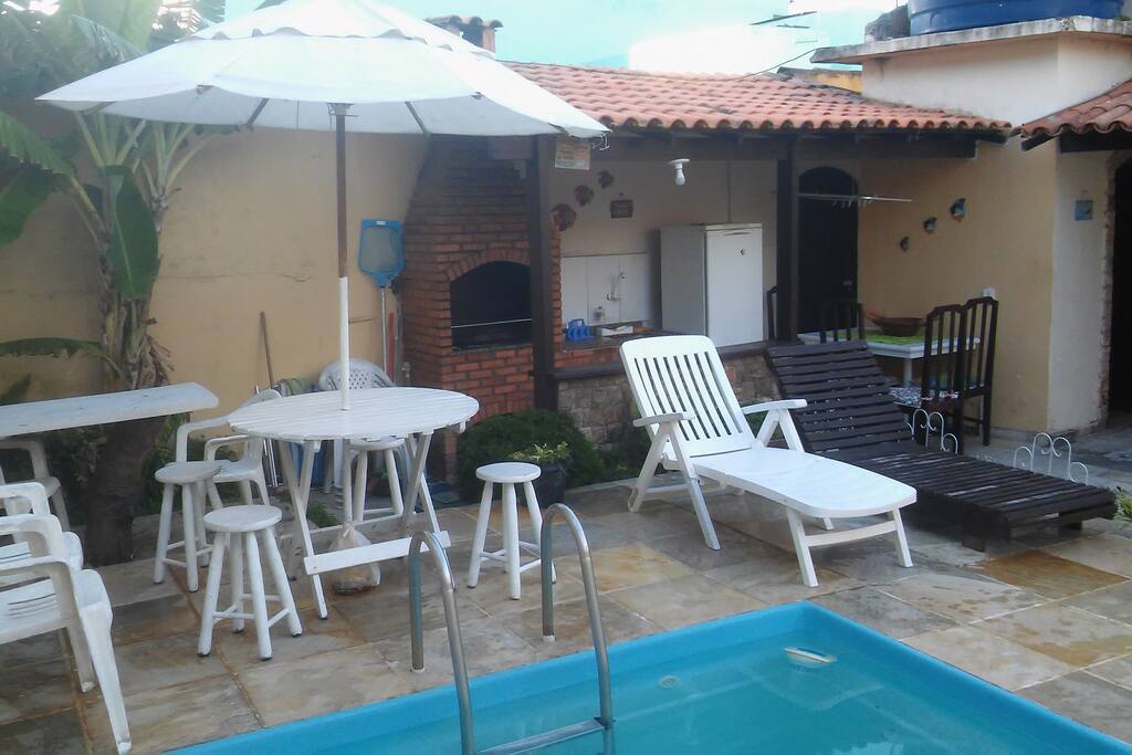area de lazer com piscina churrasqueira