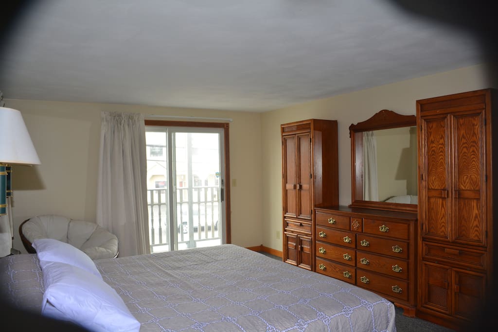 master bedroom, king bed with a balcony