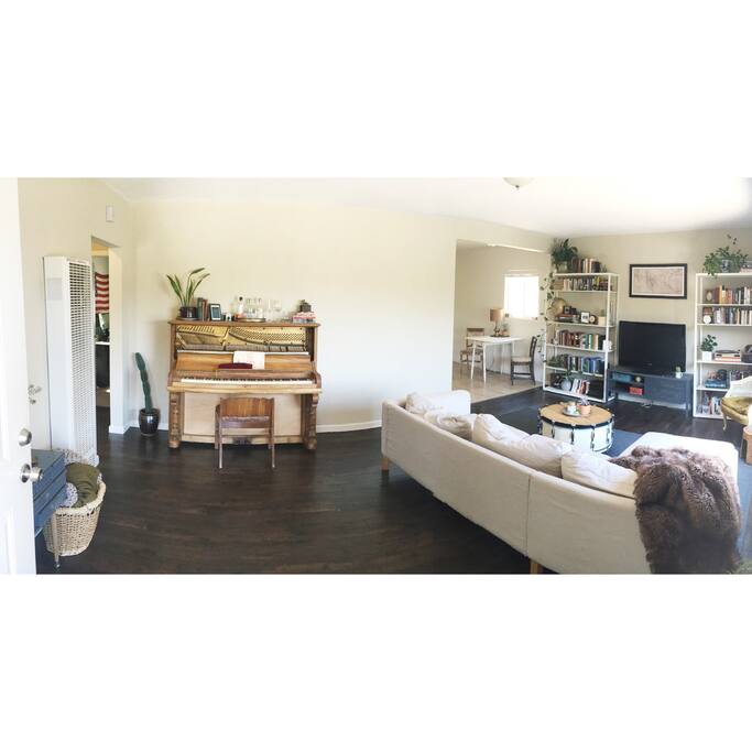 Entry way, with our 100 year old piano, and a view of the dining area and living room.
