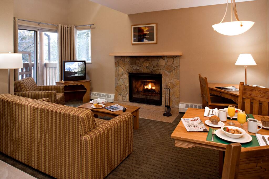 The lovely open-concept living area is rustic and cozy.